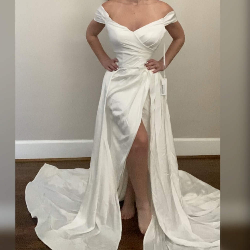 Wedding dress with long overskirt train
